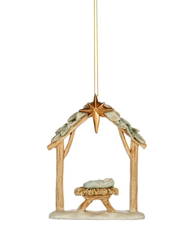 Decorative nativity scene ornament with star and manger on a white background
