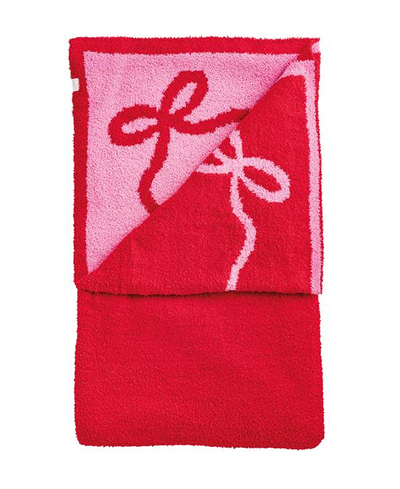 Red blankets with pink bow design on a white background