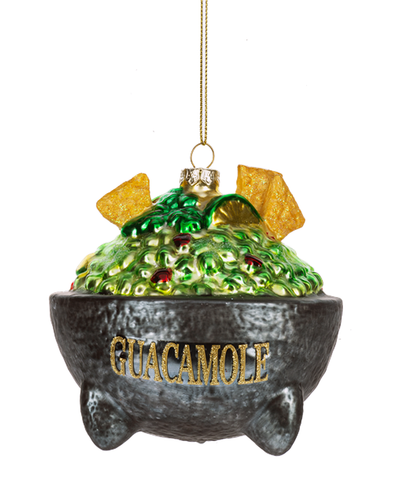 Decorative ornament shaped like a bowl of guacamole with tortilla chips on a white background