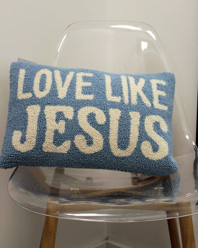 Blue and Cream pillow that states, "LOVE LIKE JESUSS"