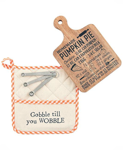 Potholder with measuring tools and wooden tag with pumpkin pie recipe on a white background