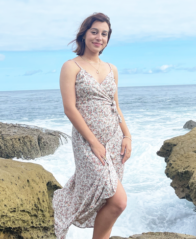 The Adella dress has the tiniest of dust rose, pink, greens, and the lightest of tans making up this adorable print. This floral wrap dress will have you singing like an ocean mermaid this summer. 
