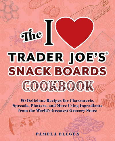 Book cover of 'The I Love Trader Joe's Snack Boards Cookbook' with a heart symbol and illustrations on a pink background.