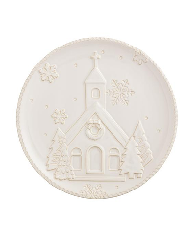 Decorative plate with a church and snowflake design on a white background