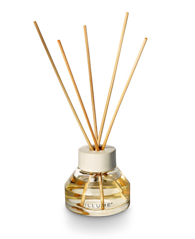 Reed diffuser with wooden sticks on a white background