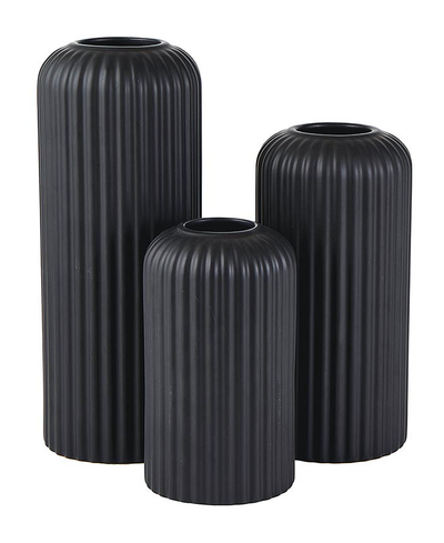 Three black ribbed vases of different sizes on a white background