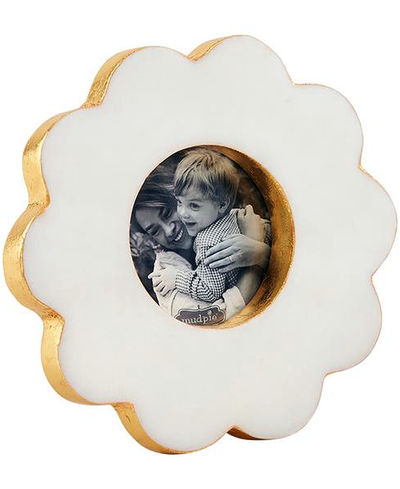 Decorative photo frame shaped like a cloud with a picture of two children inside.