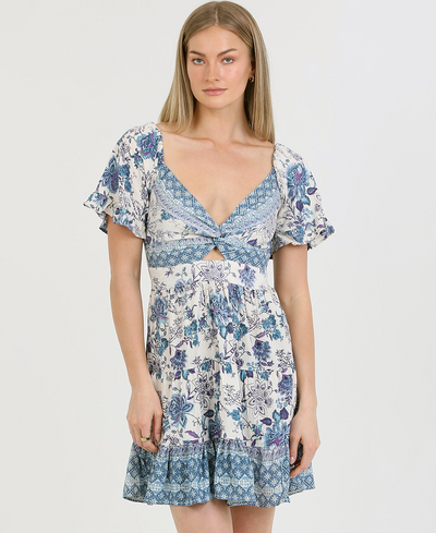 Woman wearing a floral dress with a white background