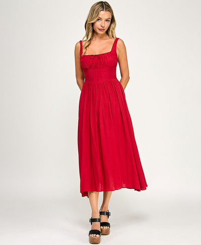 Woman wearing a red dress on a white background