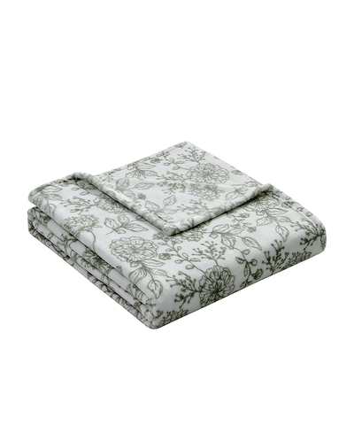 Floral patterned quilt set on a white background