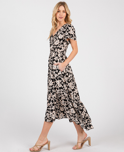 Woman wearing a floral dress on a white background