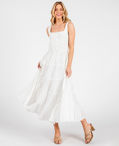 Woman wearing a white dress on a white background