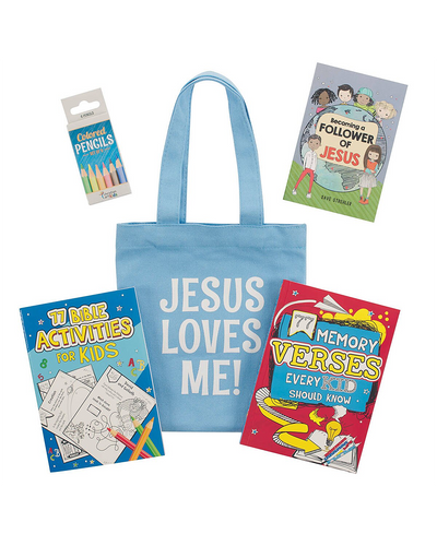 Blue tote bag with 'Jesus Loves Me!' text, surrounded by children's books and a pencil pack on a white background.