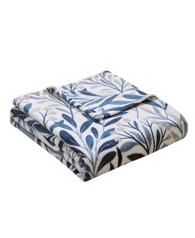 Folded blanket with blue and gray leaf pattern on a white background