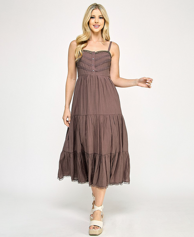 Woman wearing a brown dress on a white background