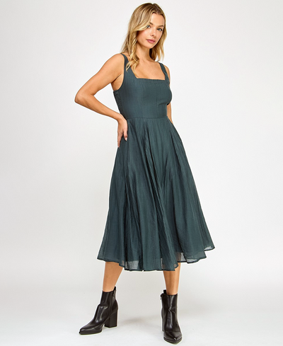 Woman wearing a green dress on a white background