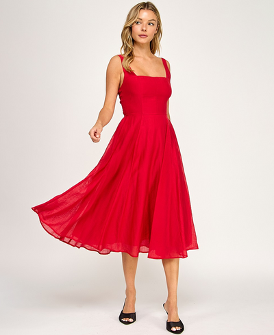 Woman wearing a red dress on a white background