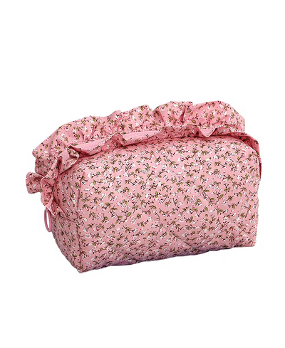 Pink floral-patterned bag on a white background