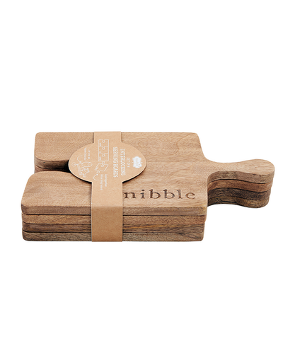 Set of 4 wooden cutting boards with 'nibble' branding on a white background