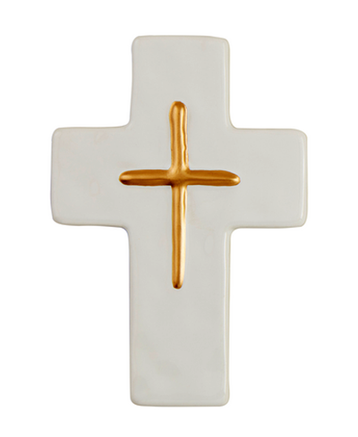White cross with a gold center on a white background