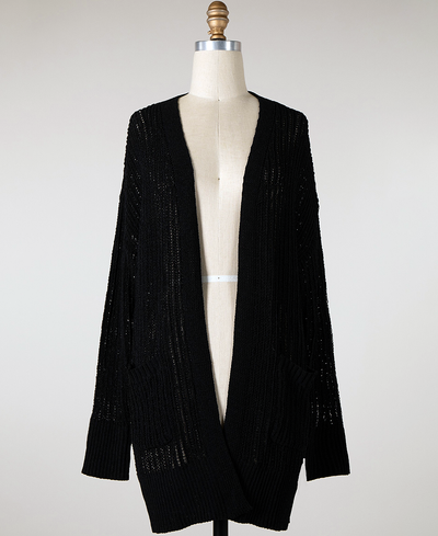 Black cardigan on a mannequin against a white background
