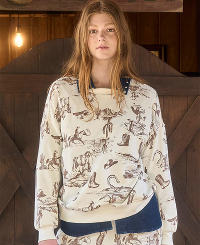 Person wearing a patterned sweater with a wooden background