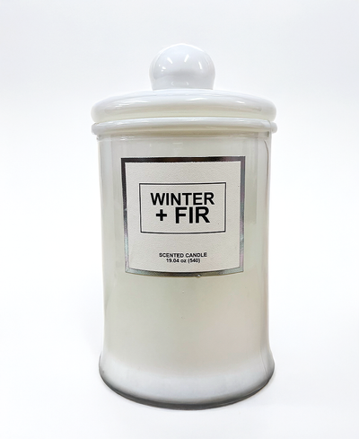 White candle jar with 'Winter + Fir' label on a white background