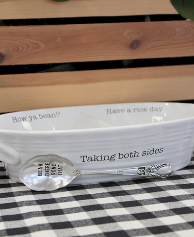 dish that reads "taking both sides." One side of the dish says "How ya bean?" and the other reads, "Have a rice day?"
