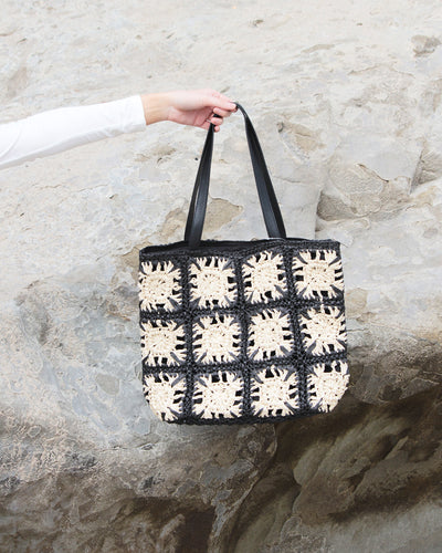 Black and ivory shoulder bag with floral stitch 