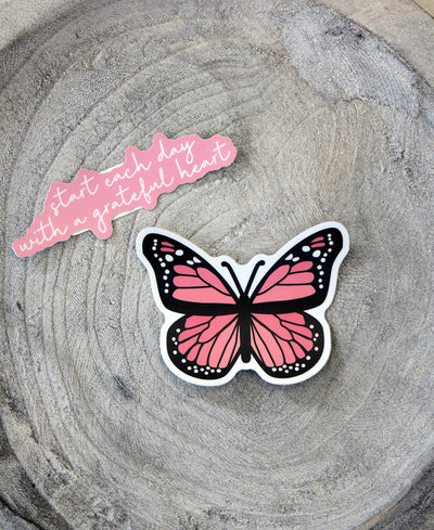 set of two stickers. One states, "Start each day with a grateful heart" and the other sticker is a pink butterfly.