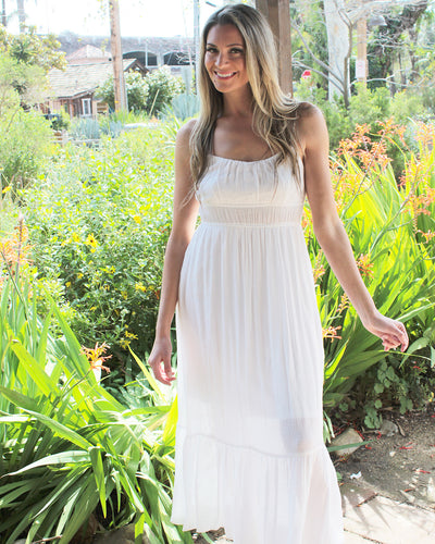 White maxi dress with spaghetti straps and lining from knees up