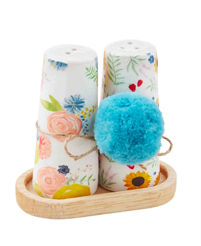 floral salt and pepper shaker with small wooden tray